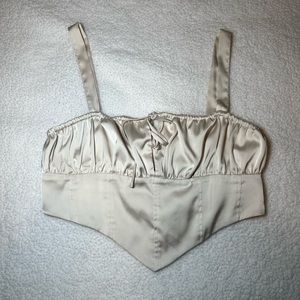 lite beige dinner top with tied string in the middle